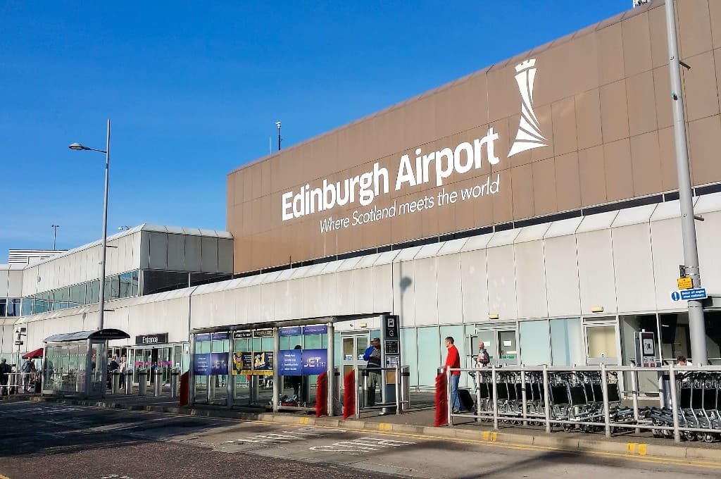 Edinburgh Airport terminal entrance with Edinburgh Airport signage and Where Scotland meets the world